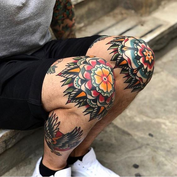 Guy shows off his colorful tat design on his knee cap