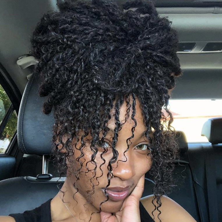 Selfie of Kailyn Rogers rocking this twists with curls 