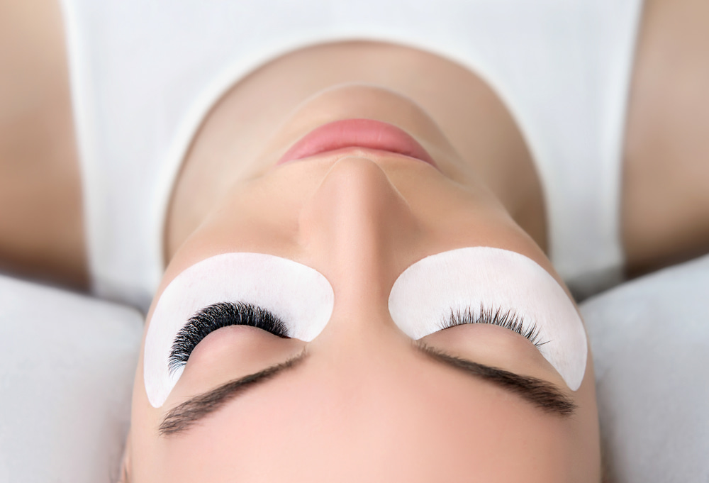 Beauty Boss Makeup Academy - A woman lying still during the lash procedure