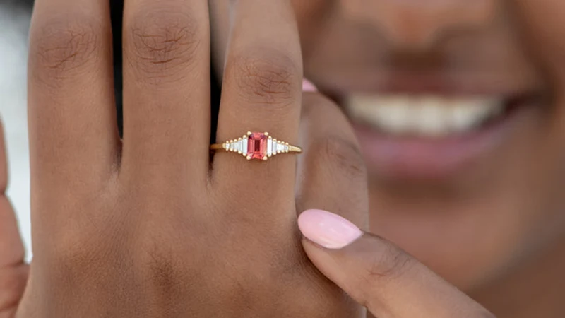 Padparadscha jewelry in hand