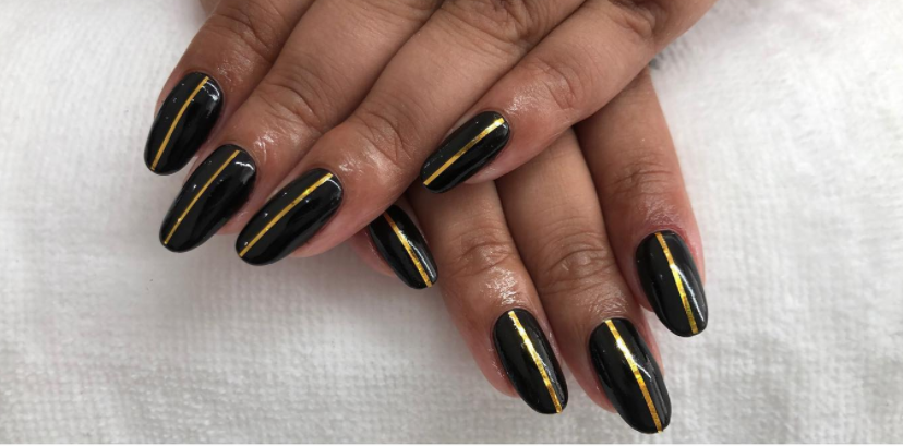 Black shellac acrylics with gold strip black and gold nail designs