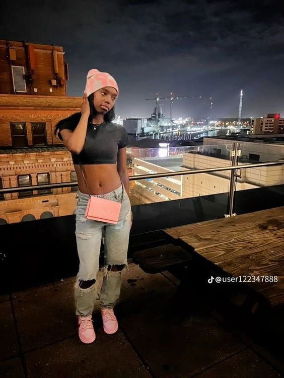 Girl on crop top shows off her triple pink dunk