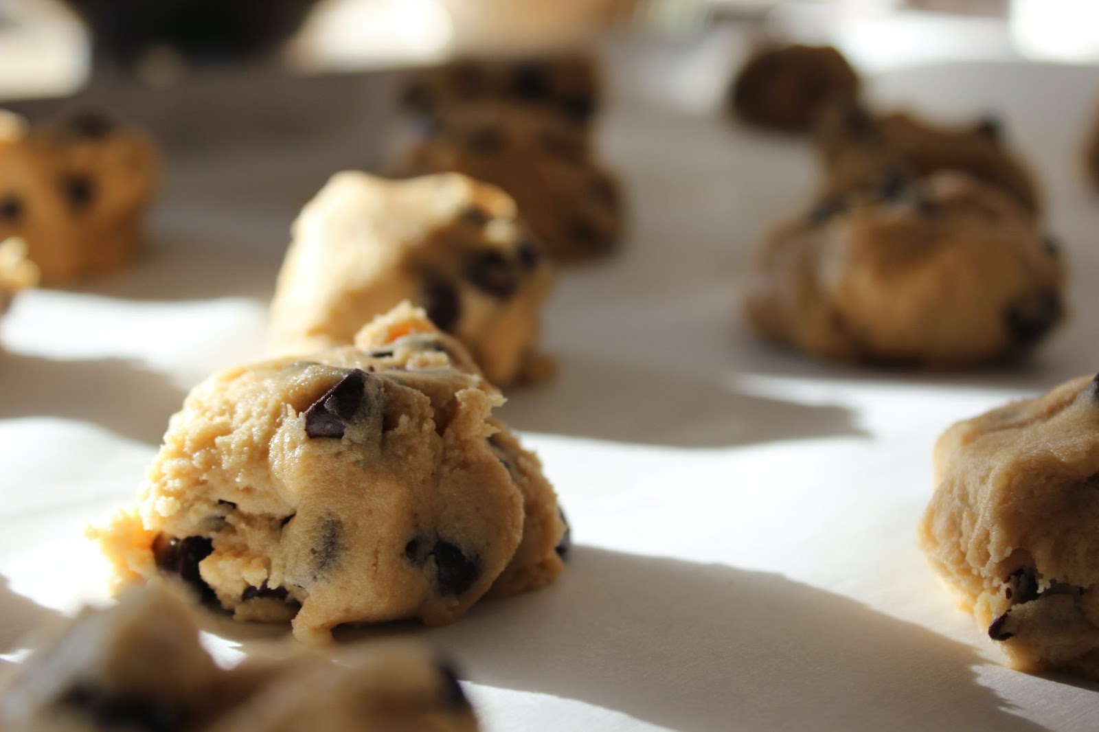 Image shows a batch of cookie dough, ready to be baked.