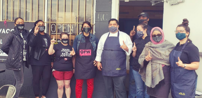 Photo of Rashida with workers