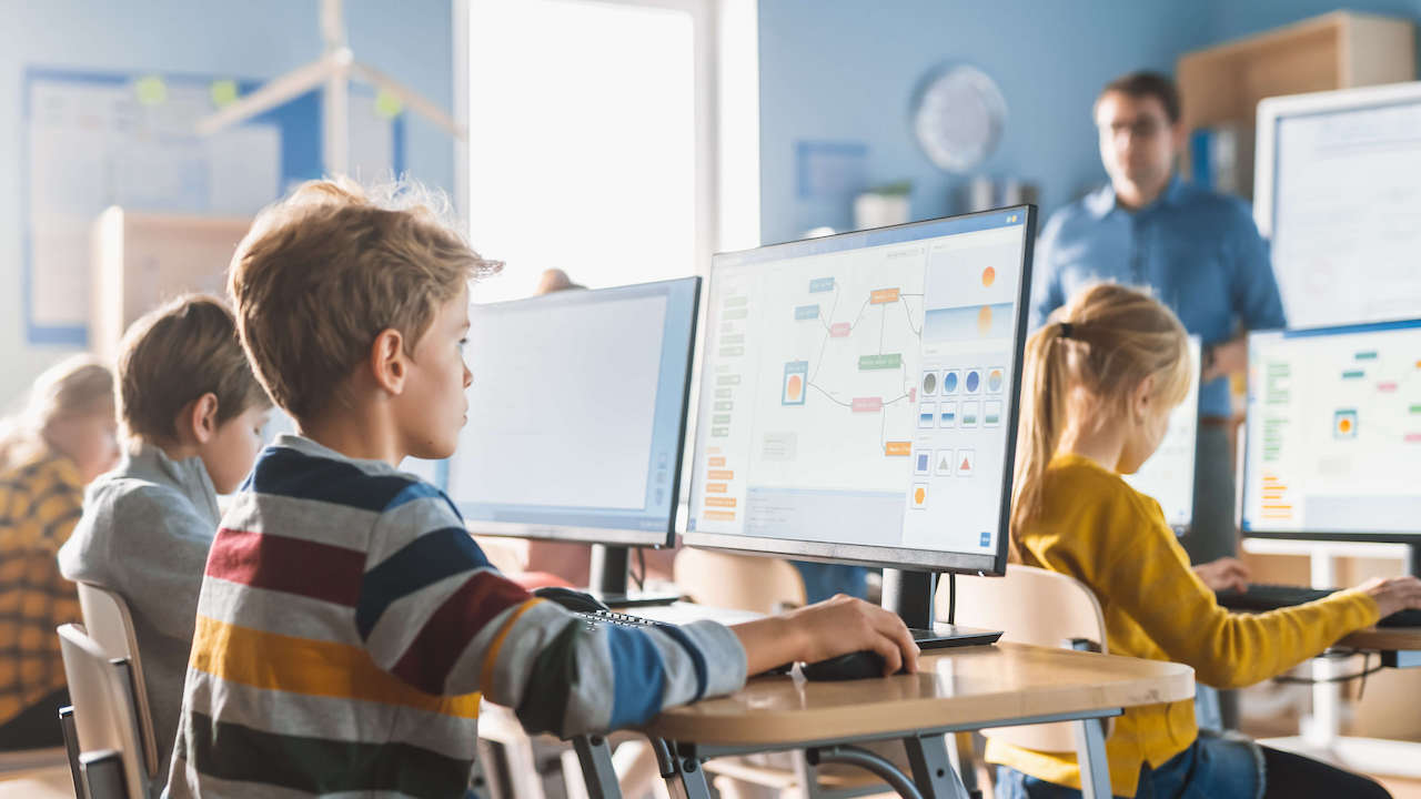 children coding in a computer class
