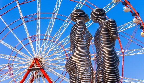 batumi sculptures in front of ferris wheel