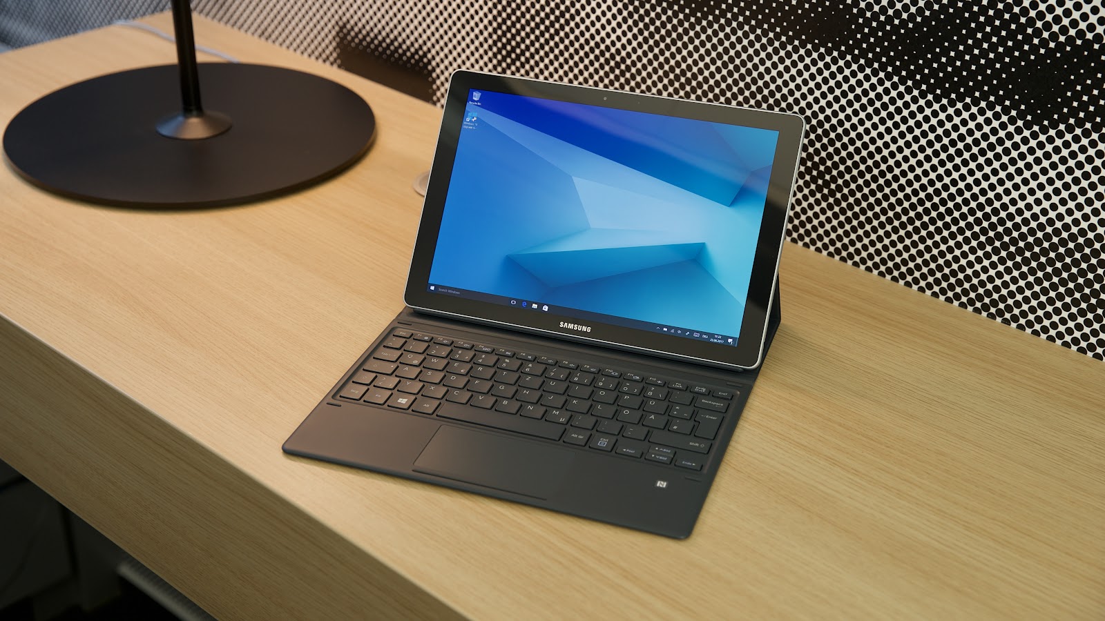 This image shows the Samsung Galaxy Book 2 Pro 360 in the table.