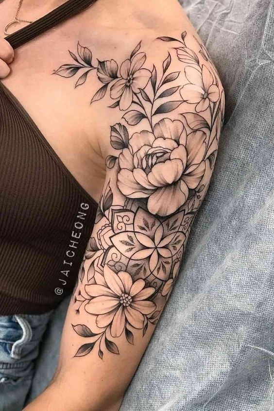 lady wearing plant short sleeve tattoo on her shoulder