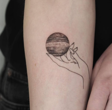 Hand Holding A Planet 