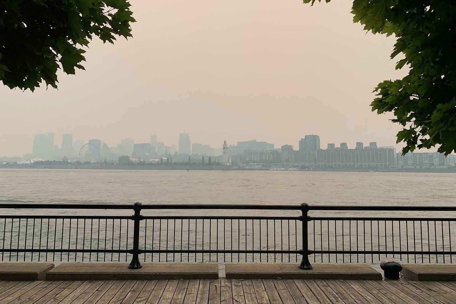Montreal's skyline is pictured from Jean Drapeau Park with smoke caused by the wildfires, in Montreal, Quebec, on June 25, 2023. Montreal had the worst air quality in the world according to IQ Air. Environment Canada issued a Smog warning because of the smoke and discouraged exercise and spending too long outdoors. © ANNE-SOPHIE THILL/AFP via Getty Images