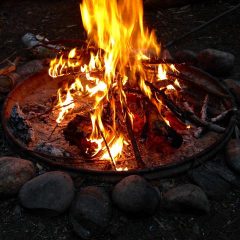 Enjoying a rare campfire after a long day of backpacking in Michigan. 