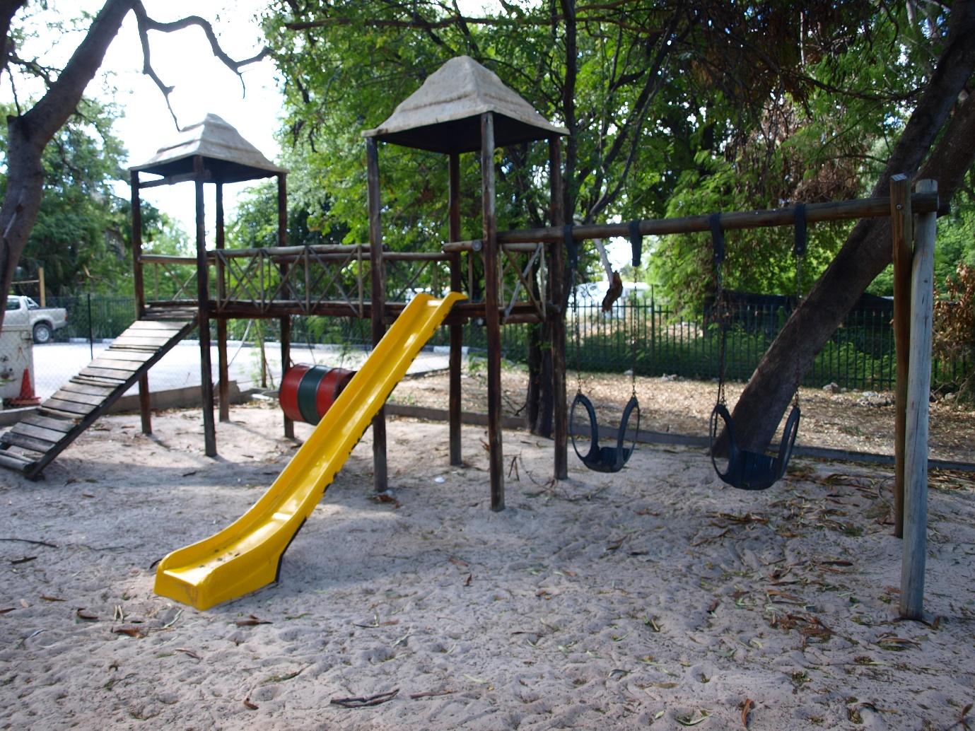 A picture containing ground, tree, outdoor, playground

Description automatically generated