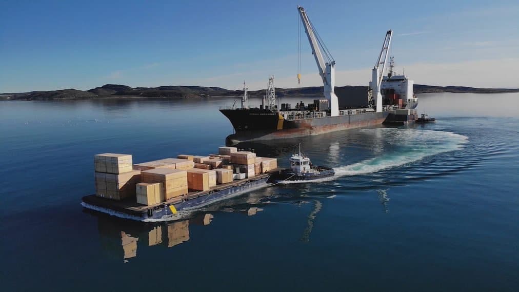 How to move millions of pounds of surlpus food over Canada: Unloading an NSSI ship in Nunavut in June 2022 to deliver to the shores of remote communities.