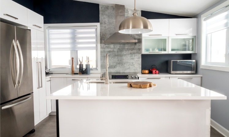 A kitchen with updated cabinets and countertops