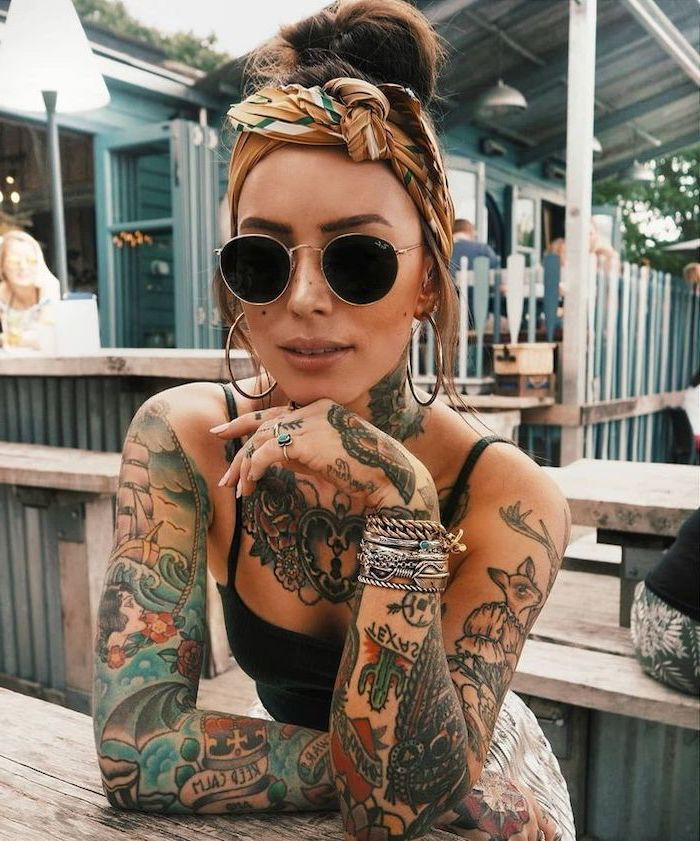 lady wearing sleeve tattoo on both arms