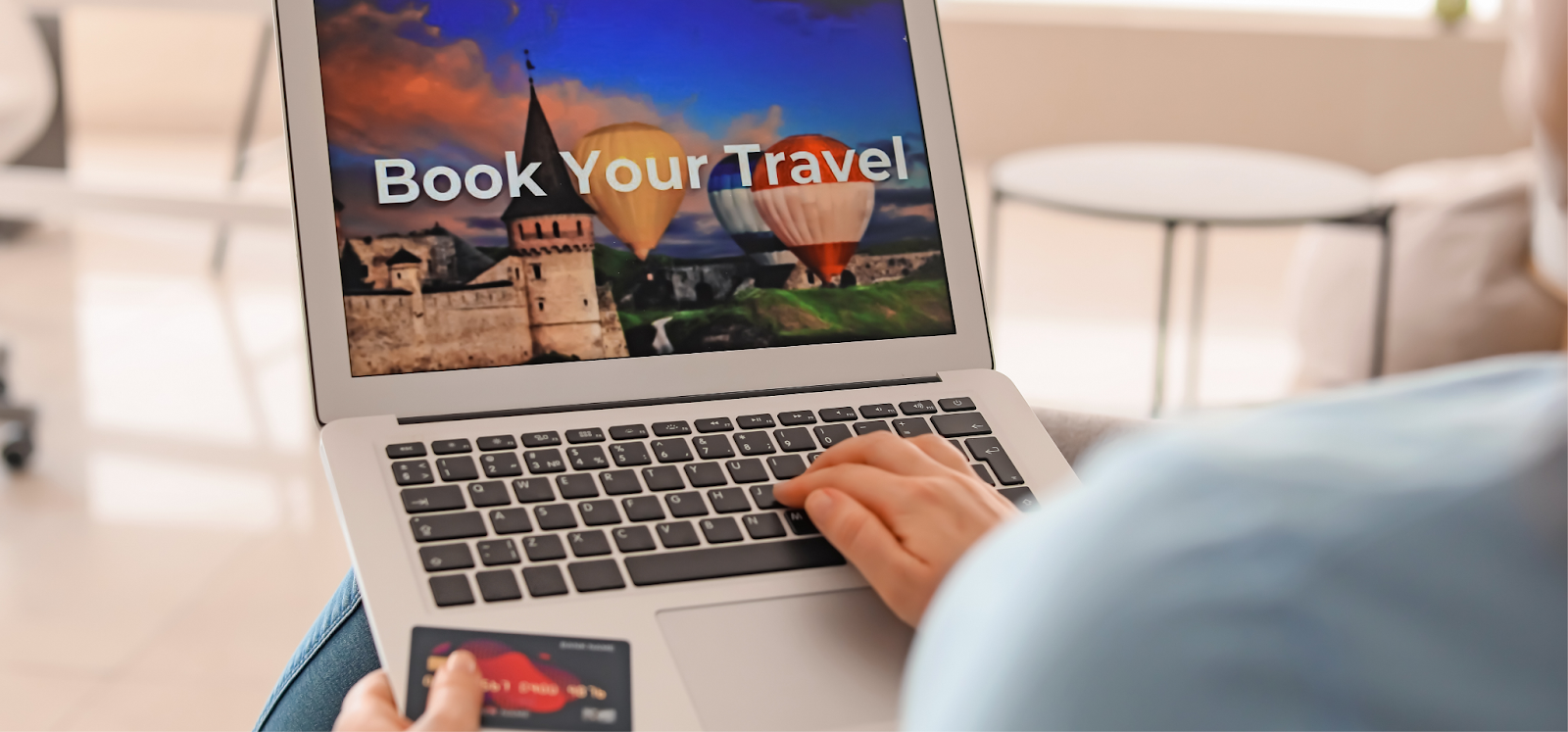 A traveler is booking a hotel using his laptop because of the excellent OTA strategy for hotels