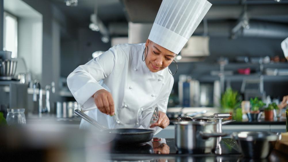 Chef preparing meals in a sustainable commercial kitchen