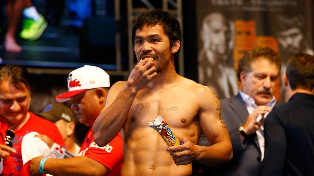 Manny Pacquaio gaining weight after weigh-in by eating a butter finger peanut butter cup