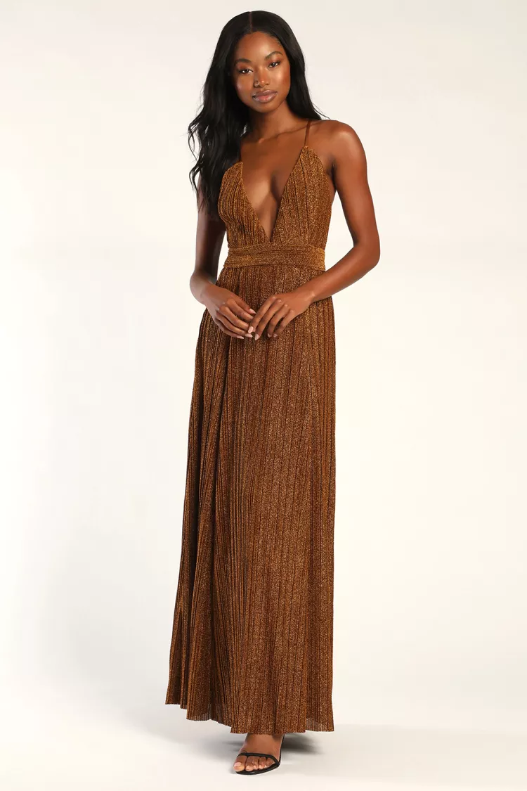 a lady in a brown plunging neckline maxi dress

