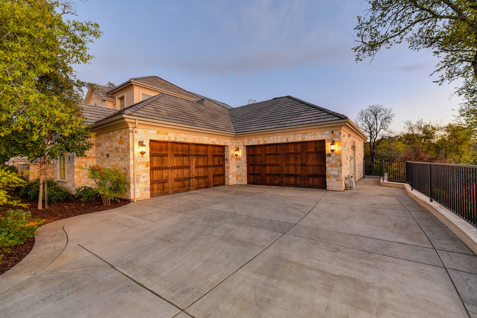 view of a home with a high end wooden garage door