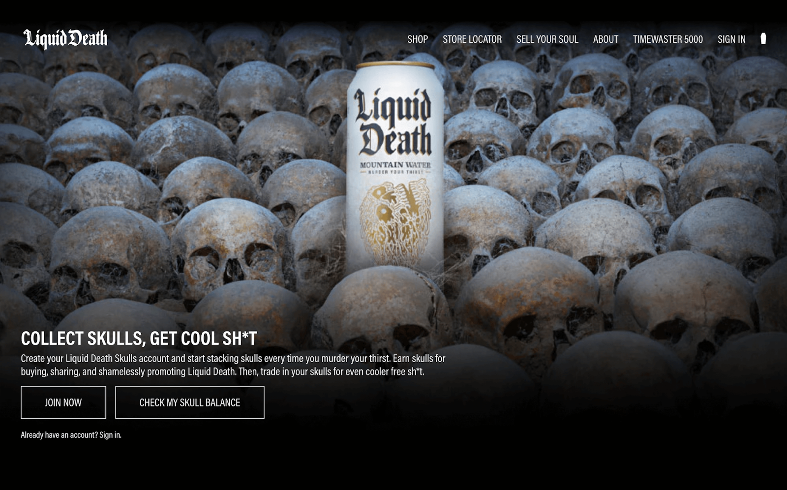 Top 10 Loyalty Programs 2022–A screenshot from Liquid Death’s loyalty program explainer page. There is a white can of their Liquid Death Mountain Water among a floor of skulls. The text reads, “Collect Skulls, Get Cool Sh*t. Create your Liquid Death Skulls account and start stacking skulls every time you murder your thirst. Earn skulls for buying, sharing, and shamelessly promoting Liquid Death. Then, trade in your skulls for even cooler free sh*t.” There are two buttons at the bottom that read, “Join Now” and “Check My Skull Balance”. 
