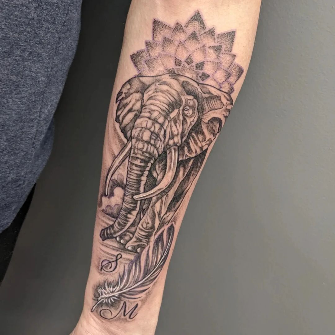 Unique Elephant With Feather Tattoo