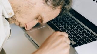a-adult-man-working-on-his-computer-and-frustrated-from-his-work-and-depressed