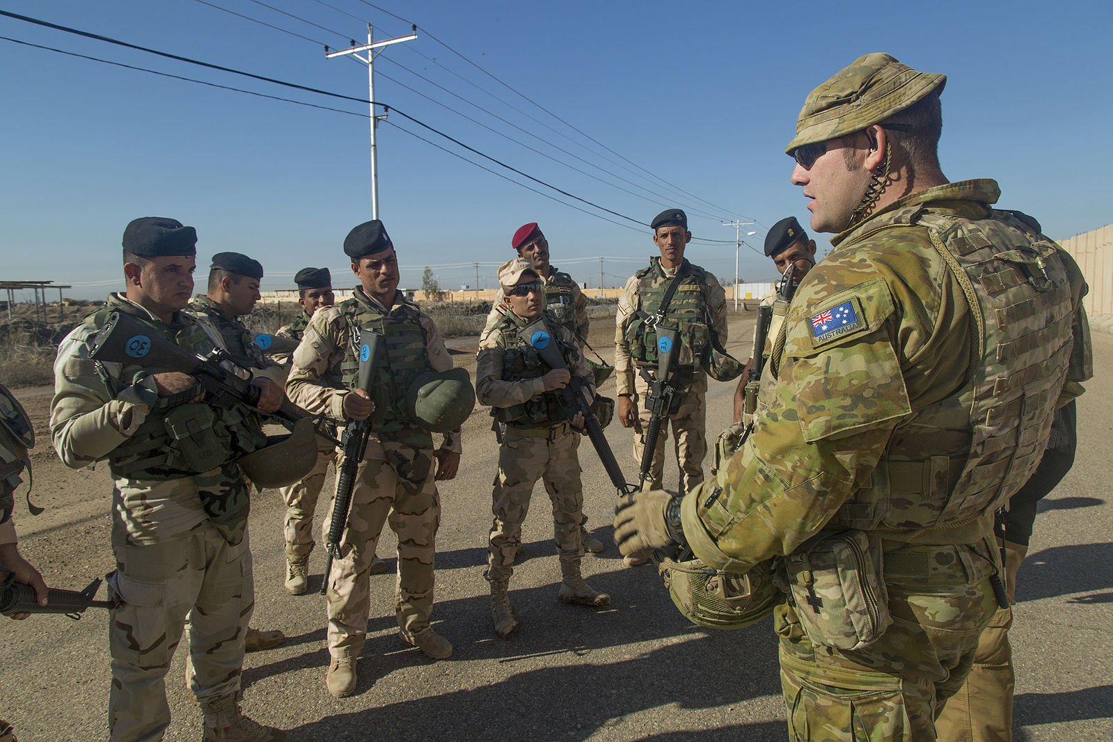 An_Australian_soldier_assigned_to_Task_Group_Taji_conducts_an_after_action_review_with_Iraqi_soldiers_assigned_to_71st_Iraqi_Army_Brigade_at_Camp_Taji_in_November_2015.jpeg