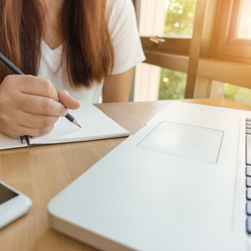 girl writing in notebook