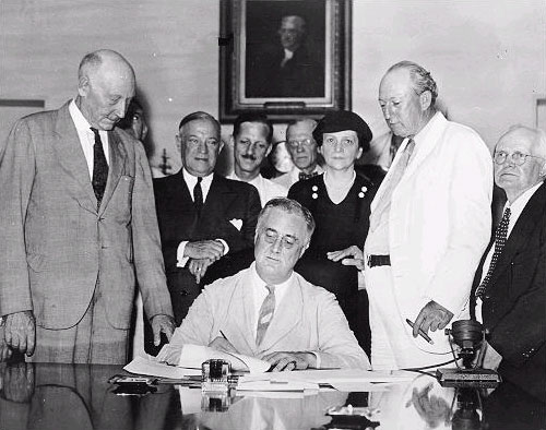 Image from 1935 of FDR signing the Social Security Act