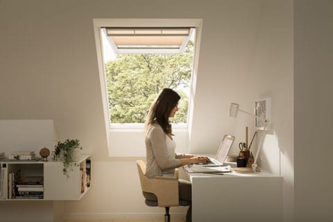 top hung roof window with woman working
