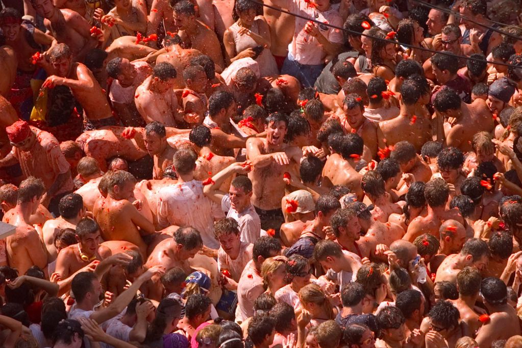 Revellers throw tomatoes at each other during the Tomatina fiesta in Spain's eastern village of Bunyo