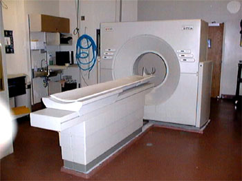Photograph of a CT scanner, demonstrating the patient table and gantry