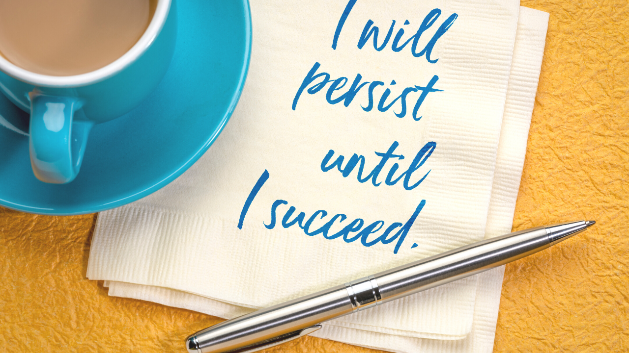 a cup of coffee with a napkin next to it with the words i will persist until I succeed.