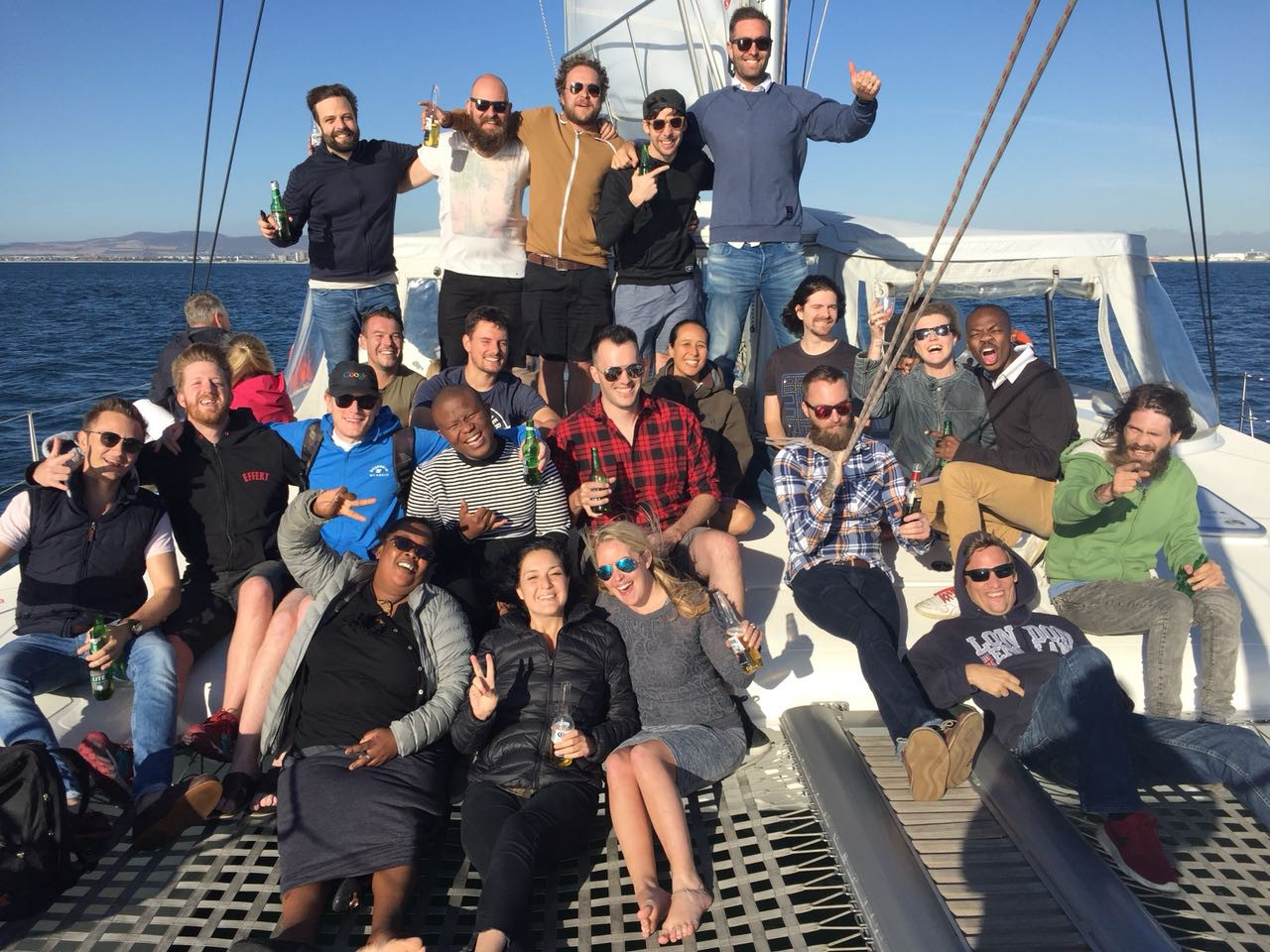 Nona Digital team saying cheers from a mf boat! - for Pangea.ai post.