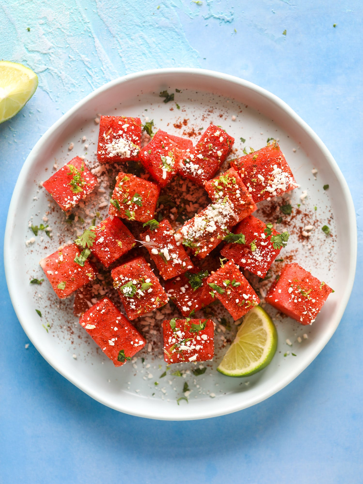 Chili lime water melon plated with a wedge of lime. 