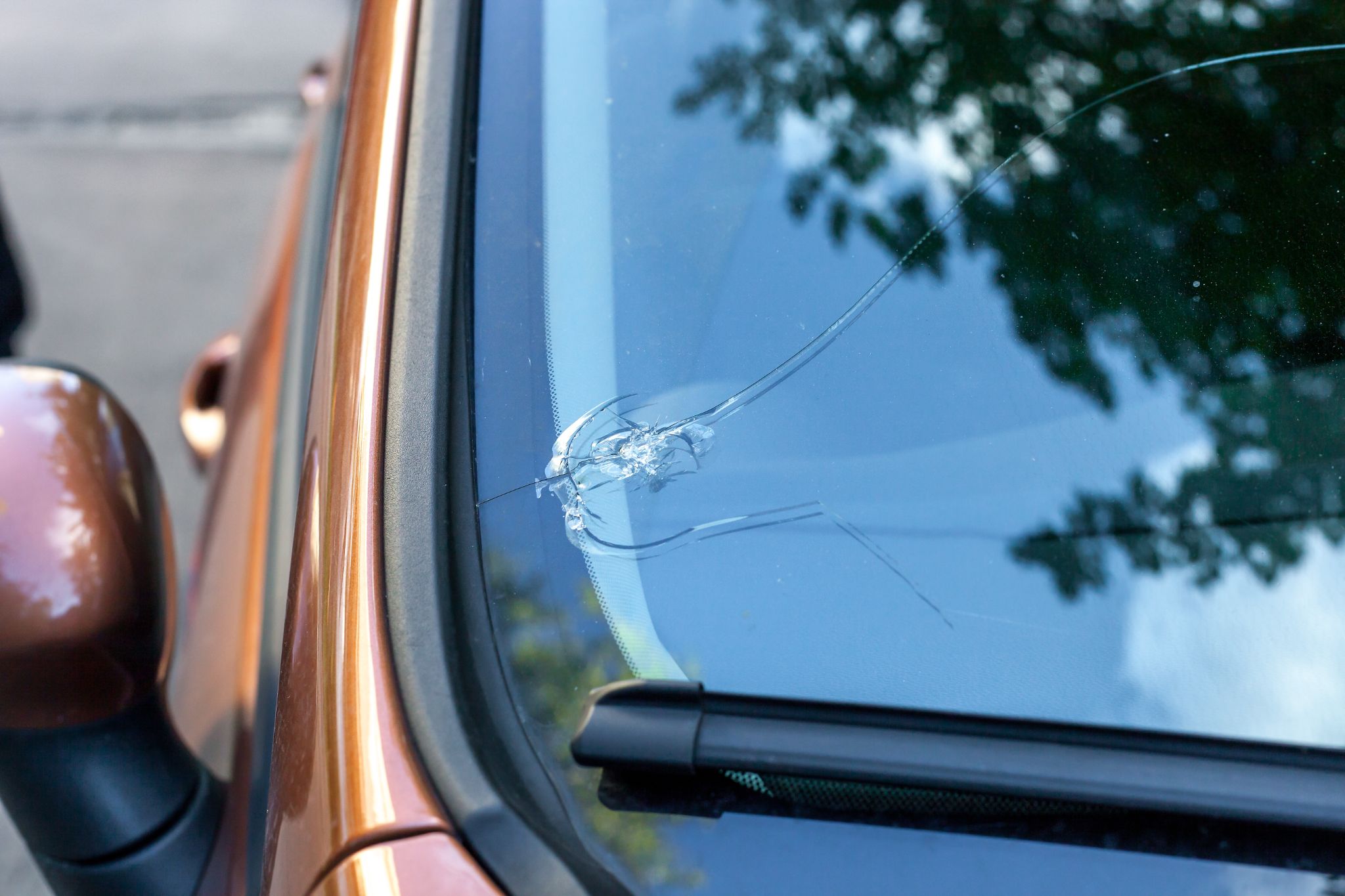 Windshield with edge crack.