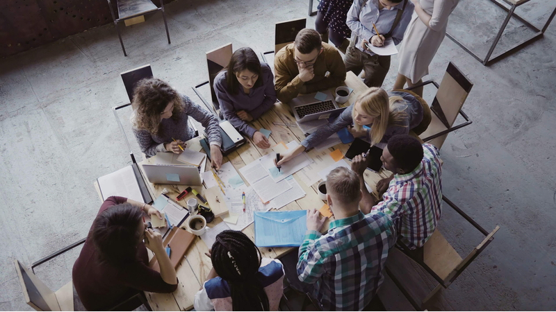 People in office discussing high performance culture