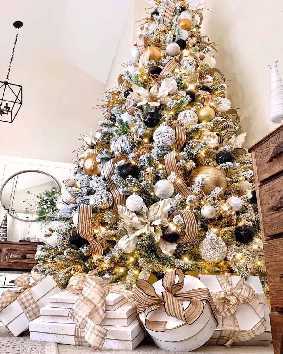 Towering white gold black Christmas tree