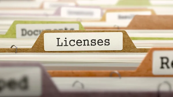 depositphotos_85448338-stock-photo-licenses-on-business-folder-in