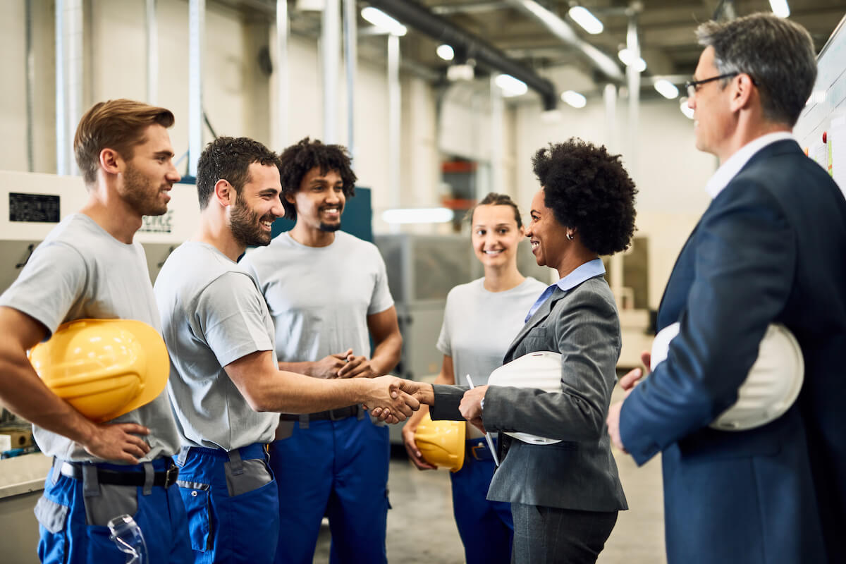 Workplace safety: Supervisor and worker shaking hands