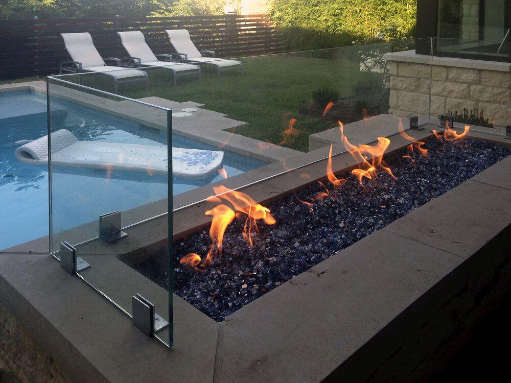 Glass panel around a fire pit