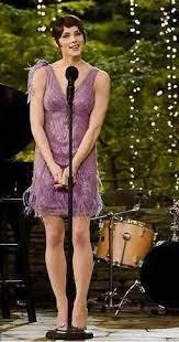 A person wearing a purple dress

Description automatically generated with low confidence