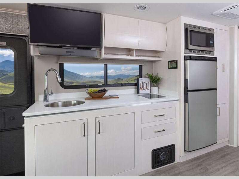 The kitchen is perfect for making quick meals before heading out on the water.