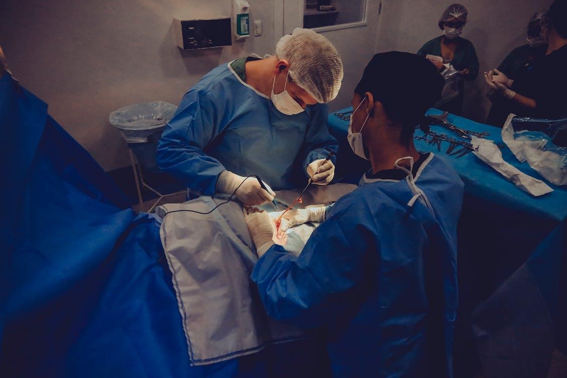 Free Man Operating a Surgery Stock Photo