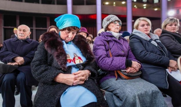 People attend in the inauguration holy mass in the Temple of Divine Providence, in Warsaw, Poland, on November 11, 2016.