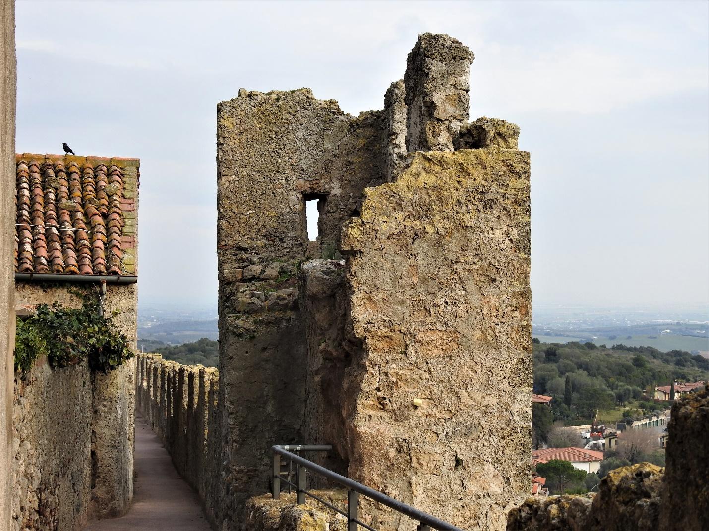 A castle on top of a rock

Description generated with very high confidence