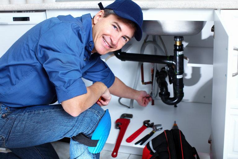 plumber-fixing-under-sink_b.jpg