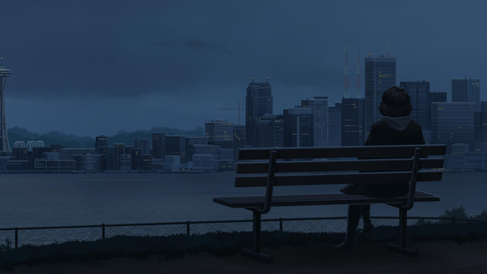 A woman sits on a bench overlooking a lake and city.