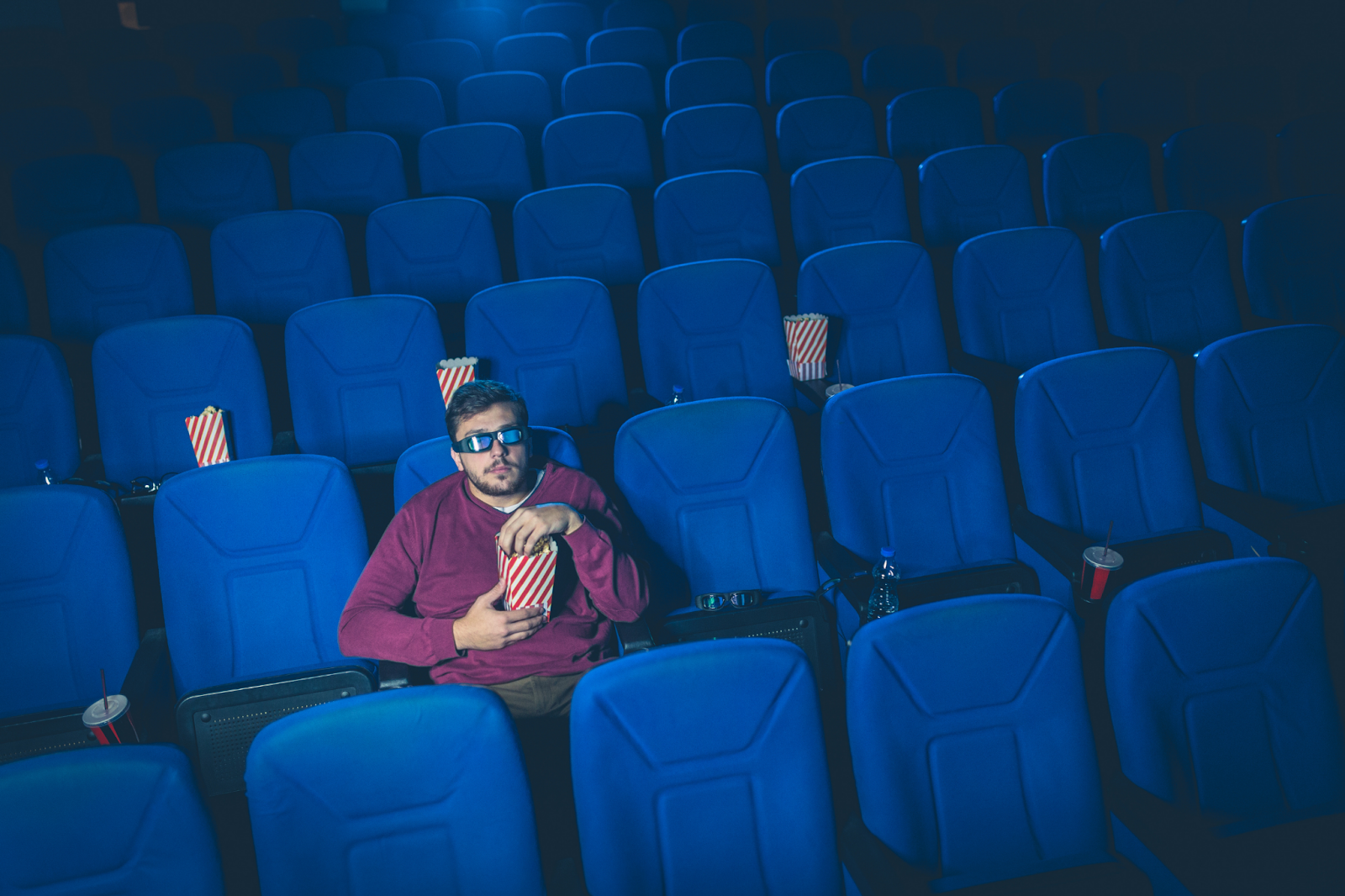 guy watching movies alone